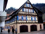 Gertrud, Eugen, and Elfriede walking outside the town wall in the Gerberviertel, the tanner's quarters, past the town's second mill, the Äußere Mühle, and it is the oldest half-timbered house in Schiltach, built in 1557.
