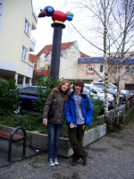 Lena and Philipp at the Elefantenvogel Kroko (1992) glass fiber synthetic bird, atop a concrete column, in the Hesselgasse; erected 2007; financed/initiated by Willi Schmidt (SchuhWolf) & the "Bürgerstiftung Kunst für Wiesloch e.V."